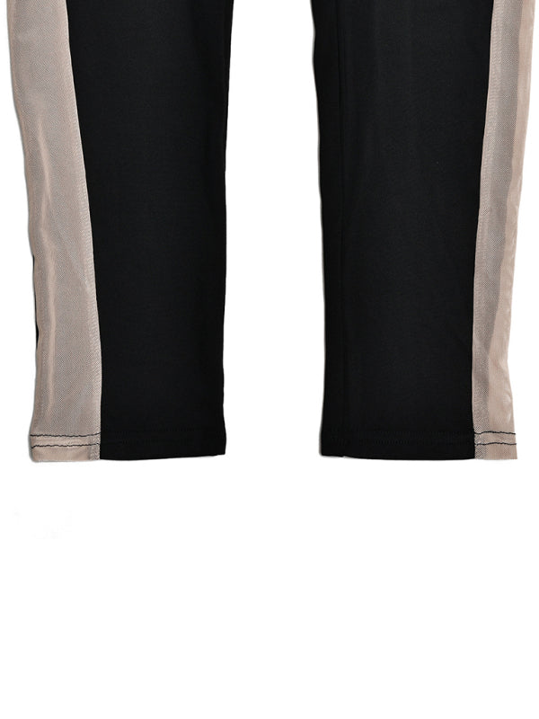 Close-up of trousers stitching on black jumpsuit