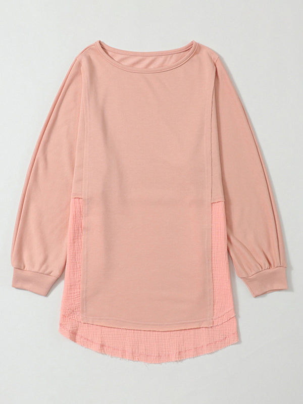 Flat lay of peach knitted pullover with side slits