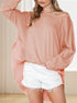 Peach loose side slit pullover with white shorts