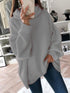 Gray loose turtleneck sweater on person
