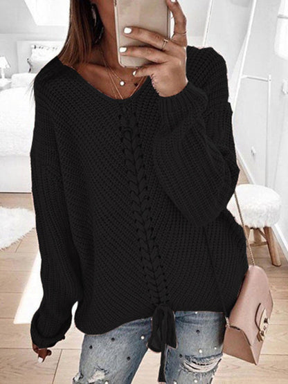 Black V-neck drawstring pullover sweater, styled with jeans