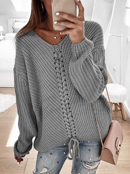 Gray V-neck drawstring pullover sweater, styled with jeans