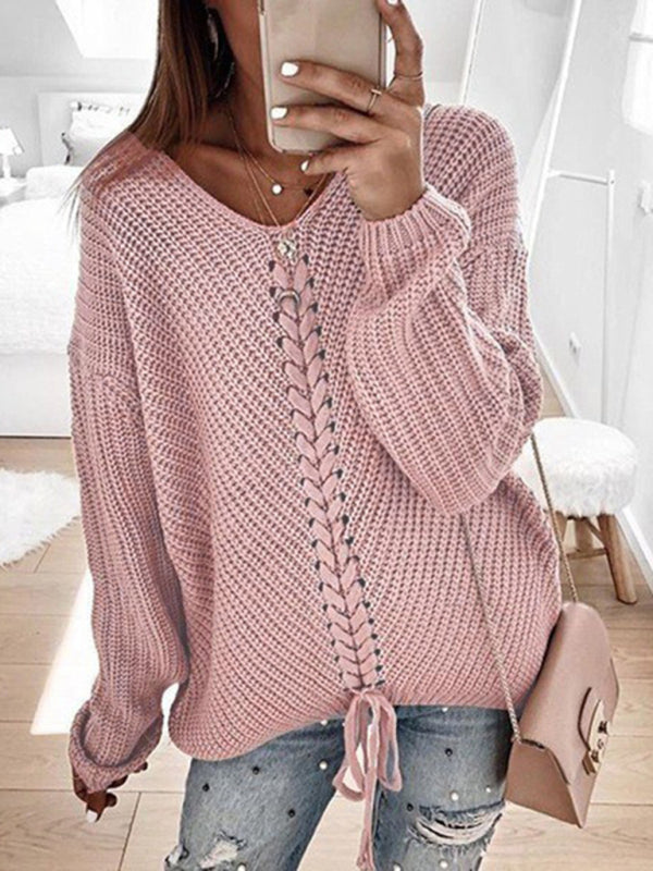 Pink V-neck drawstring pullover sweater, styled with jeans