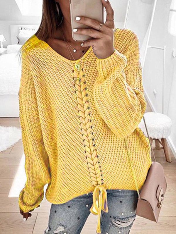Yellow V-neck drawstring pullover sweater, styled with jeans