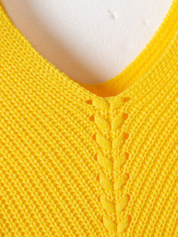 Close-up of yellow V-neck sweater knit detail