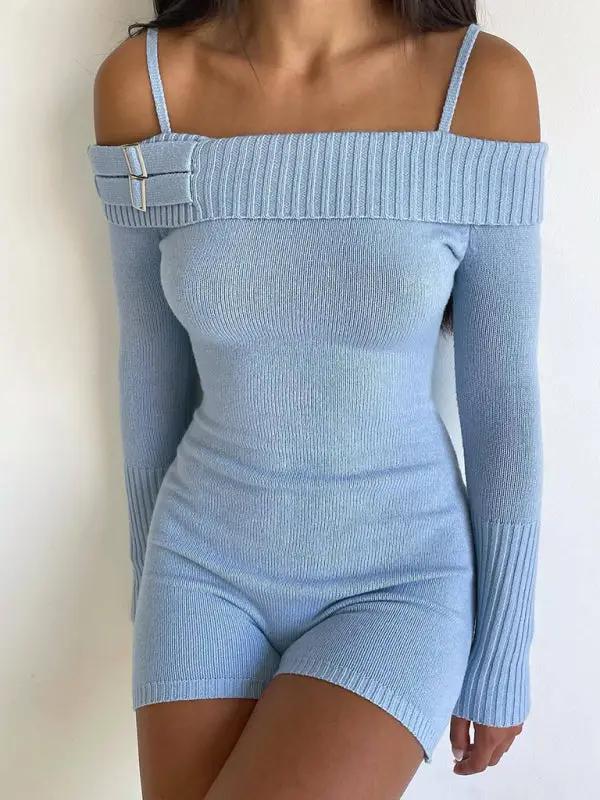 Close-up of blue knitted jumpsuit with buckle detail