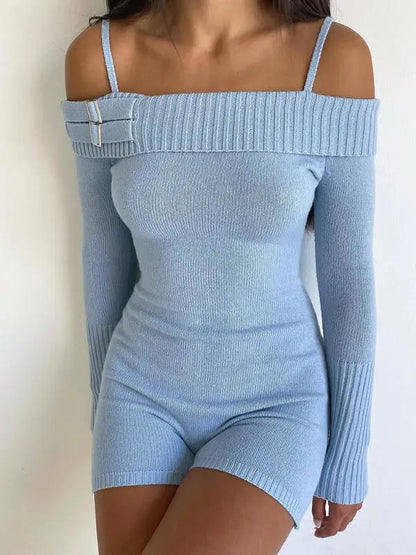 Close-up of blue knitted jumpsuit with buckle detail
