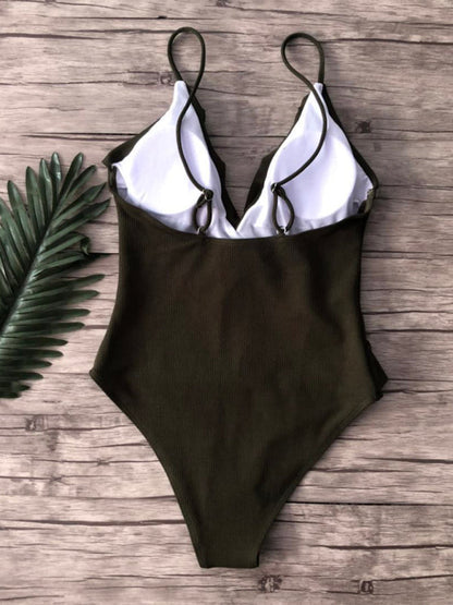 Back view of green ruffled one-piece swimsuit