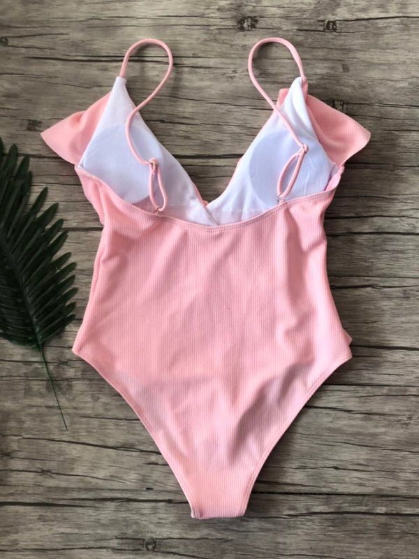 Back view of pink ruffled one-piece swimsuit