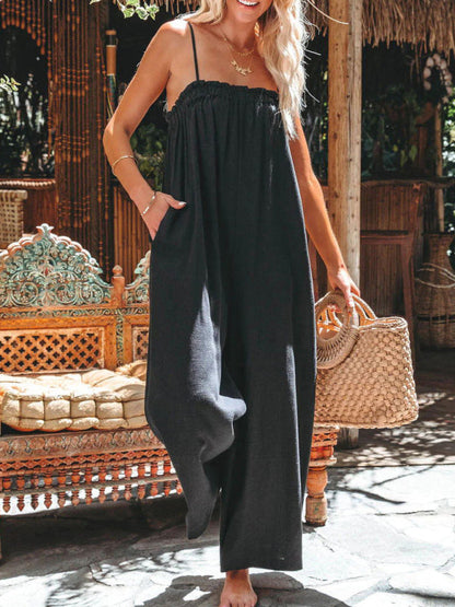 Black high-waisted wide-leg suspender jumpsuit with handbag