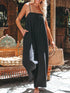 Black high-waisted wide-leg suspender jumpsuit with handbag
