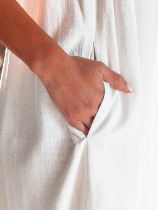 Close-up of pocket on white suspender jumpsuit