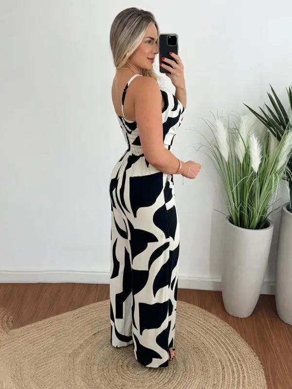 Black and white suspender jumpsuit with abstract pattern