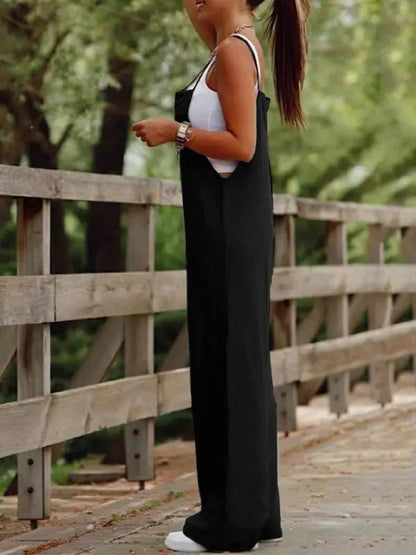 Side view of black wide leg suspender jumpsuit