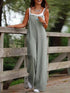 Green wide leg suspender jumpsuit, outdoor setting