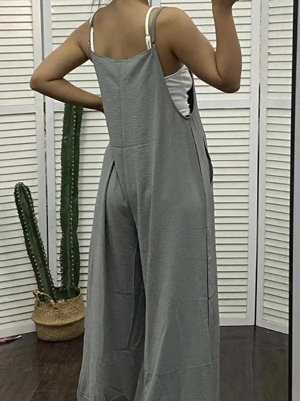 Back view of green jumpsuit worn by model