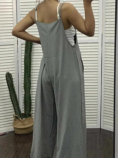 Back view of green jumpsuit worn by model