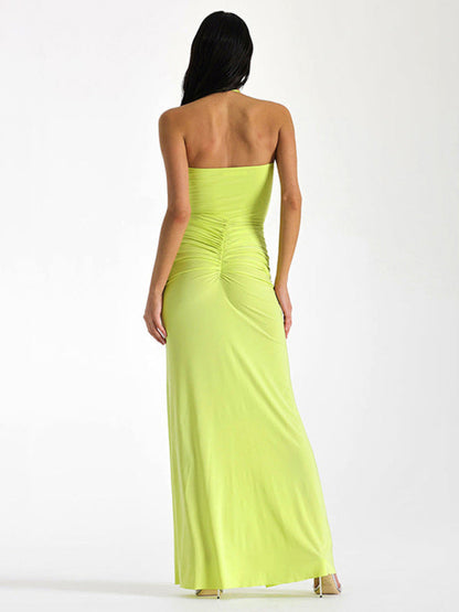 Back view of yellow halterneck slim-fit slit dress