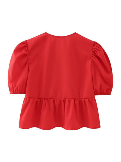 Back view of red puff sleeve shirt top
