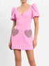 Pink V-neck dress with puff sleeves and heart sequins