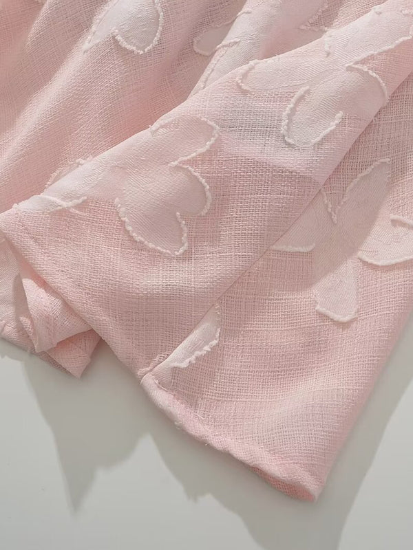 Pink flower-cut fabric texture close-up