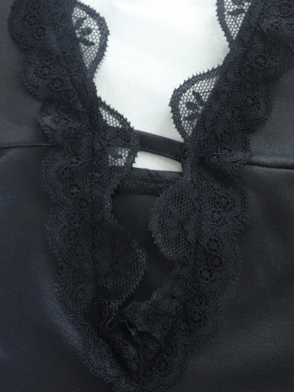 Close-up of lace detailing on black dress