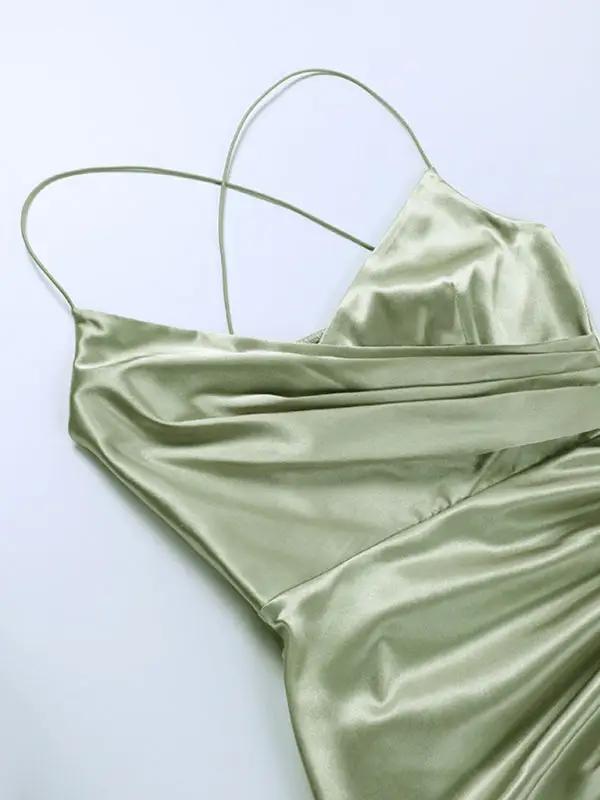 Green V-neck dress with pleated waist detail