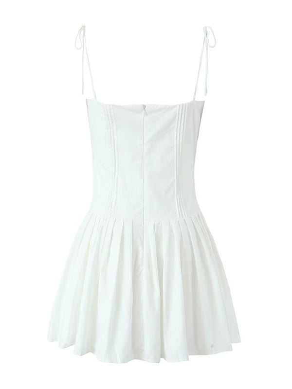 Full back view of white pleated short dress