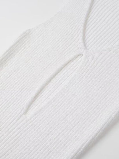 Detail of white dress with hollow slit design