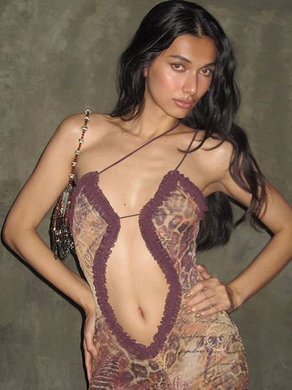 Model in sexy hollow sleeveless halter neck dress