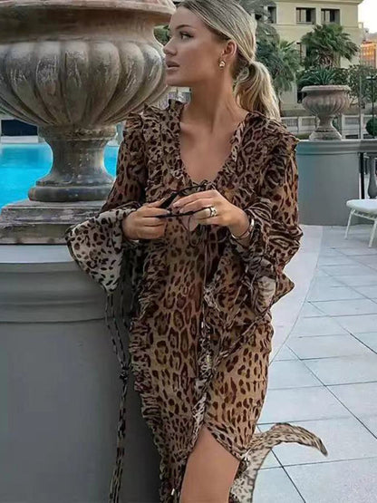 Leopard print dress with ruffled front slit by poolside
