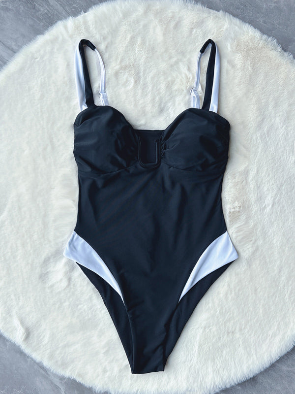 Front view of deep V contrast color one-piece swimsuit on display