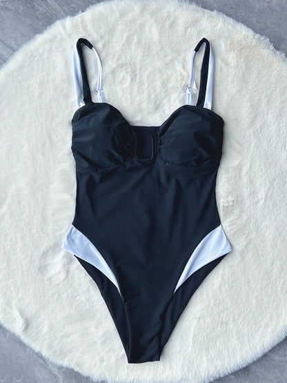 Front view of deep V contrast color one-piece swimsuit on display