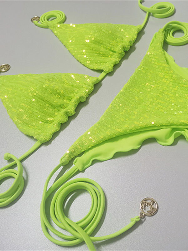 Green sequined bikini set laid flat
