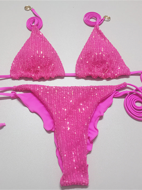 Pink sequined bikini set laid flat