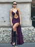 Model in purple lace slit dress with high slit