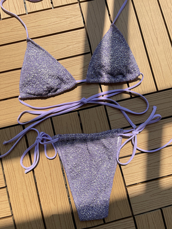 Purple glitter strap triangle bikini on wooden surface