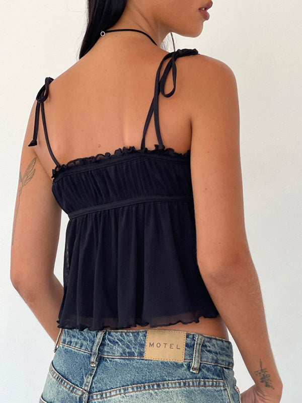 Back view of black lace suspender top with bow detail