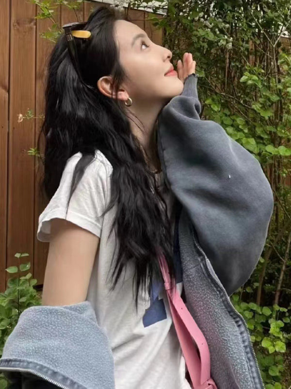 Woman wearing retro distressed high-waisted T-shirt outdoors