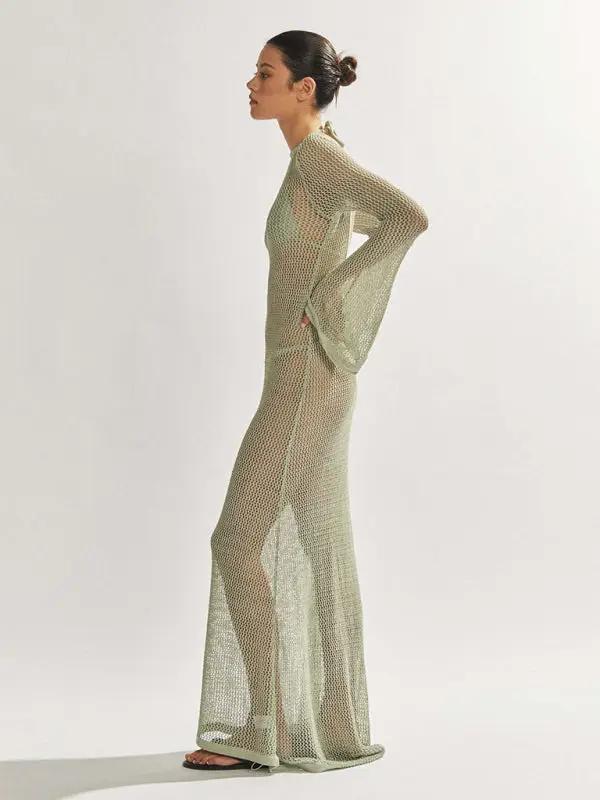 Side view of knitted see-through maxi dress, studio