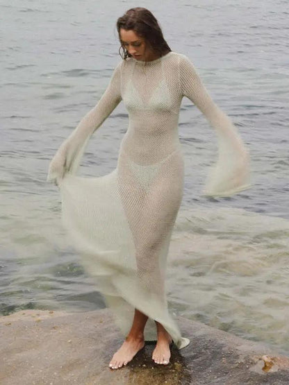 White knitted see-through maxi dress, standing by water