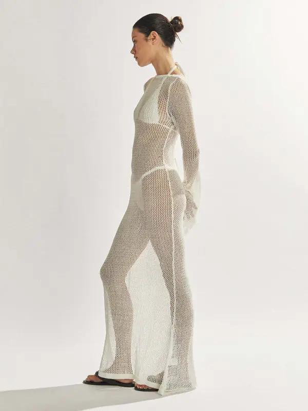Side view of white knitted see-through maxi dress