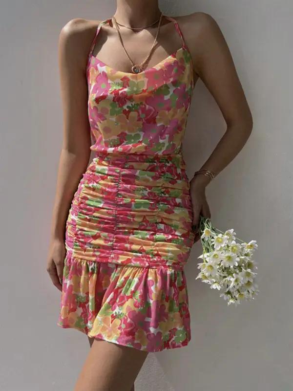 Floral print dress in pink with hip strap and ruched design