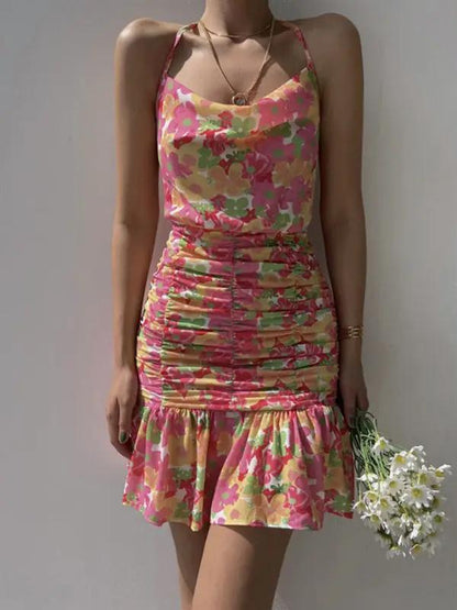 Pink floral print dress with ruched detailing and hip strap
