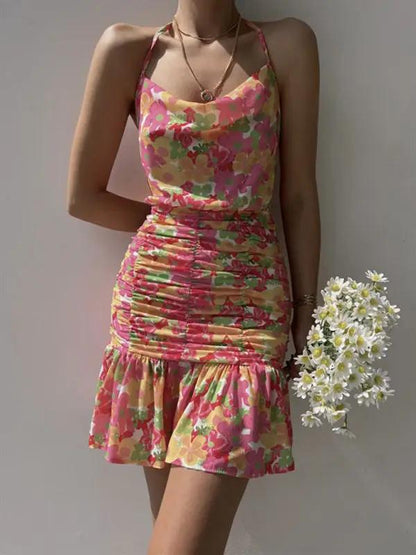 Pink floral dress with ruched skirt and hip strap