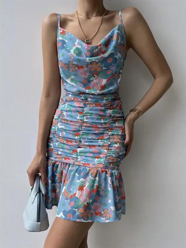 Blue floral dress with ruched skirt and hip strap