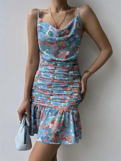 Blue floral dress with ruched skirt and hip strap