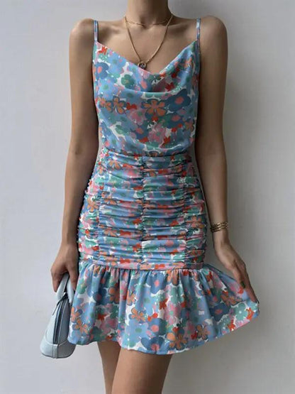 Blue floral print dress with ruched detailing and hip strap