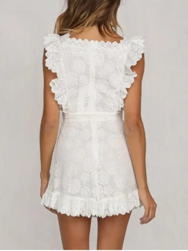 Back view of white lace dress with ruffle details