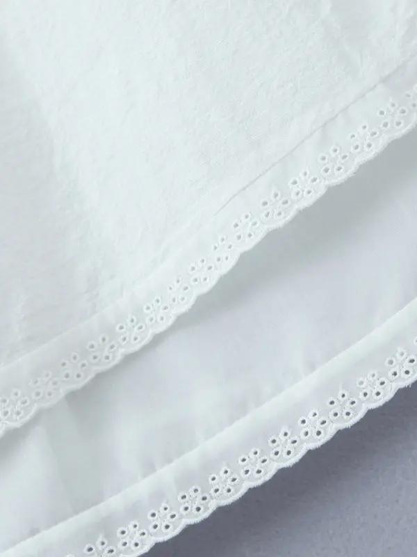 Hem detail of lace mini dress